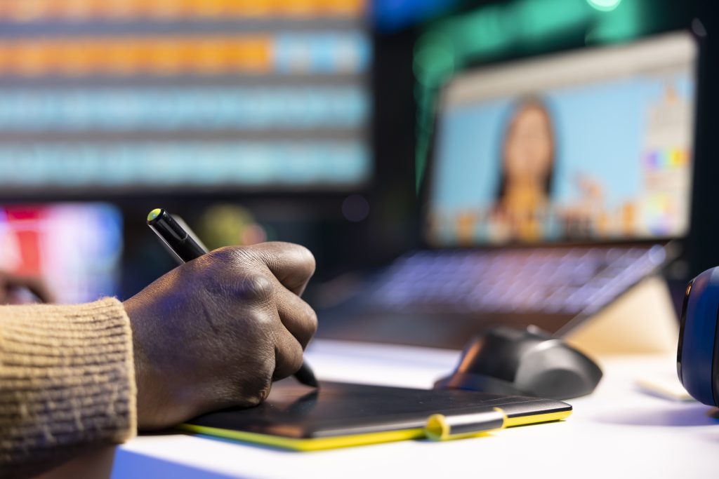 african american graphic designer working on photo retouching project